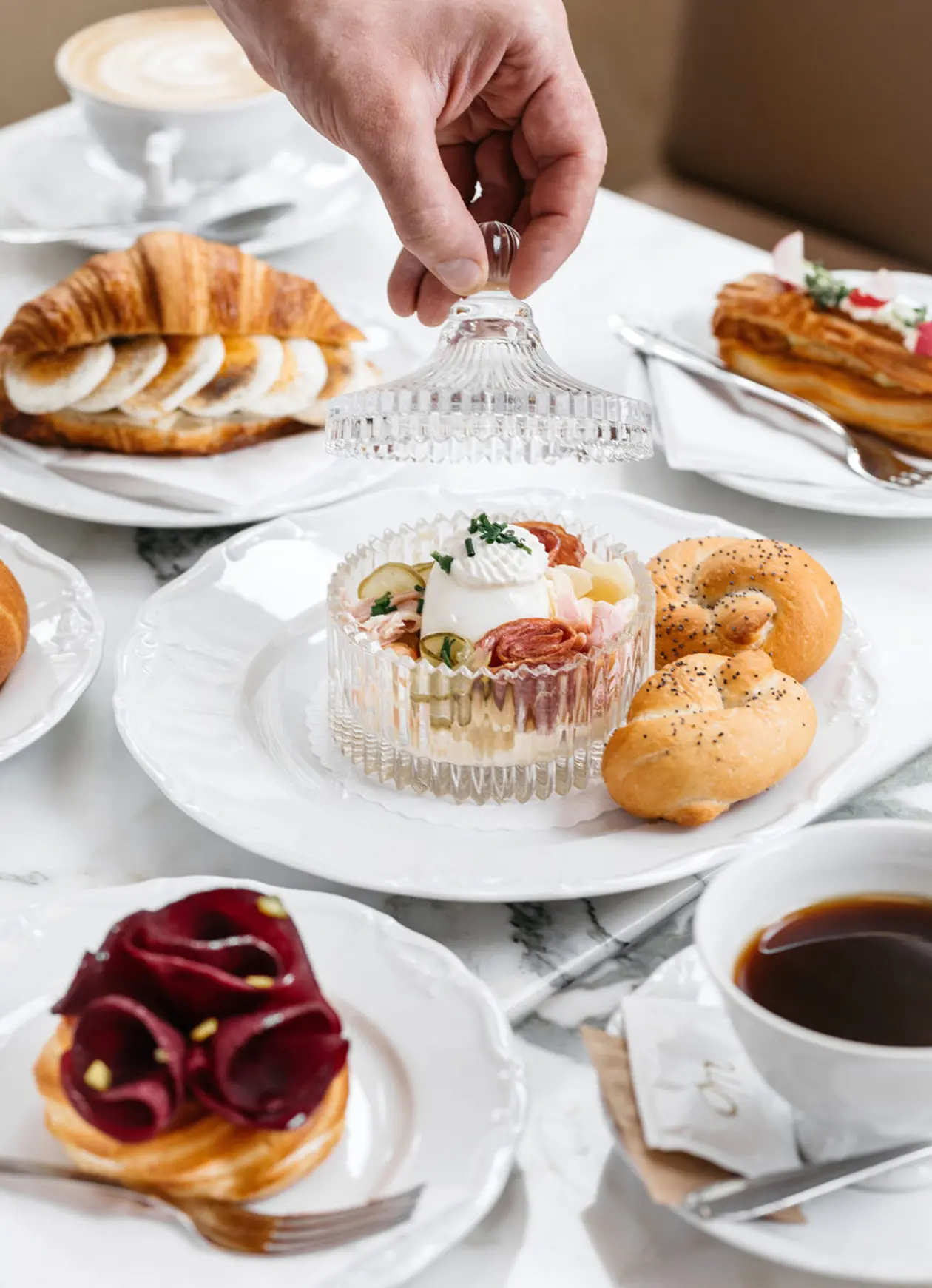 Selection of desserts with coffee at Myšák pastry shop.